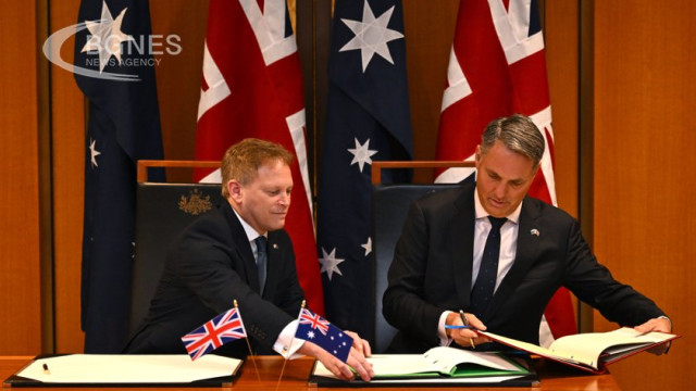 The United Kingdom and Australia have signed a new defence deal in Canberra as they try to boost a start-up nuclear submarine program with the United States